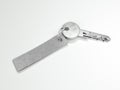 Metal key with gray blank tag. 3d rendering Royalty Free Stock Photo