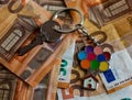 Metal key with a keychain of a house with colorful balloons, on top of a pile of euro bills. Money and economy Royalty Free Stock Photo