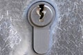 Metal key plate with keyhole of a cylinder lock in a door Royalty Free Stock Photo