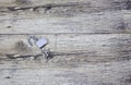 Metal keys and a steel open lock on a wooden boards.