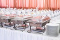 Metal kitchen equipments on the table for fine wedding dining or another catered event Royalty Free Stock Photo