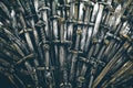 Metal knight swords background. Close up. The concept Knights. Royalty Free Stock Photo