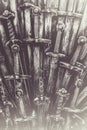 Metal knight swords background. The concept Knights. Royalty Free Stock Photo