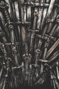 Metal knight swords background. The concept Knights. Royalty Free Stock Photo