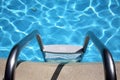 Metal ladder in pool