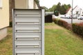 Metal letter boxes near apartment building outdoors. Space for text Royalty Free Stock Photo