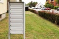 Metal letter boxes near apartment building outdoors. Space for text Royalty Free Stock Photo