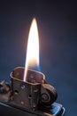 Metal lighter with flame. Royalty Free Stock Photo