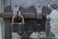 Metal lock on door into the ancient trinity christian ortodox church Royalty Free Stock Photo