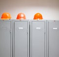 Metal lockers and plastic hard hats