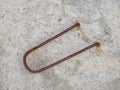 A metal loop sticks out of a concrete slab. Place for fastening to the crane. Hook for transporting a concrete slab Royalty Free Stock Photo