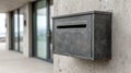 Metal mailbox on a concrete wall outside a modern building. Royalty Free Stock Photo