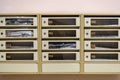 Metal mailboxes in the lobby of a residential building. numbered letterbox front view. letters, paper advertising, newspapers