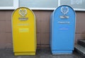 Metal mailboxes set near a post office on a street, coat of arms Ukrposhta. Kyiv, Ukraine