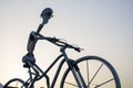Metal man with giant bicycle