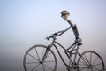 Metal man with giant bicycle