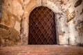 Metal massive door in a stone cave Royalty Free Stock Photo