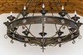 metal medieval chandelier with lightbulbs