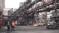 Metal melting vats being transported on big carts to the metal melting shop, heavy industry concept. Stock footage.Two