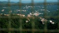 A metal mesh on a bridge, guarding against a precipice, serving as a barrier to prevent suicides, often linked to