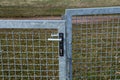 Metal mesh gate with internal lock and handle