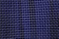 Metal mesh grid pattern in blue tone. Royalty Free Stock Photo