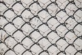 Metal mesh pattern on concrete wall background with shadow. Abstract texture. Royalty Free Stock Photo