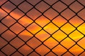Metal mesh pattern with dramatic sky background Royalty Free Stock Photo