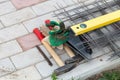 Metal mesh and working tools on the cement tiles. Selection focus. Shallow depth of field