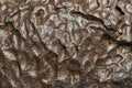 The metal meteorite surface close-up as background. Royalty Free Stock Photo