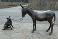 Metal monument donkey and dog. Vladikavkaz.