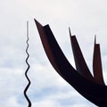 Metal Monument. On the sky background. Peace Park Almada Portugal. Monumento de ferro. Parque de Paz. CÃÂ©u nublado. Royalty Free Stock Photo