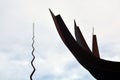 Metal Monument. On the sky background. Peace Park Almada Portugal. Monumento de ferro. Parque de Paz. CÃÂ©u nublado. Royalty Free Stock Photo