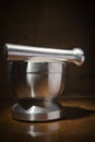 Metal mortar with pestle Royalty Free Stock Photo