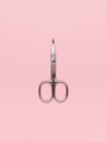 Metal nail scissors on a light pink background Royalty Free Stock Photo