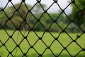 Metal net fence. Royalty Free Stock Photo