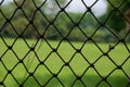 Metal net fence. Royalty Free Stock Photo