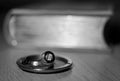 Metal nickel-plated details of a vintage camera lying on a blurred background of an old book with a gold edge Royalty Free Stock Photo