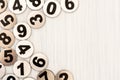 Metal numbers on white wood background