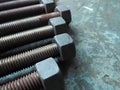 Metal Nut and Bolt arrange on iron table.