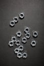 Metal nuts group on a black table Royalty Free Stock Photo