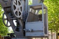 Old exterior of retro construction crane control room.