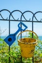 Metal ornament on a balustrade in a seaside village, a symbolic