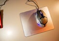 A metal pad for a computer mouse. Stylish mouse pad made of metal and eco-leather. Royalty Free Stock Photo