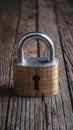 Metal padlock secures financial success on old wooden table