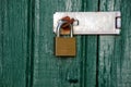 Metal padlock on wooden door Royalty Free Stock Photo