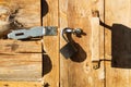 Metal padlock on a wooden door Royalty Free Stock Photo