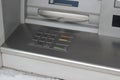 Metal panel of ATM with keyboard for code pin entry with inscriptions in English and Ukrainian Royalty Free Stock Photo