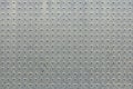 Metal panel covered with rhombic pattern. Royalty Free Stock Photo