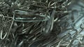 Metal paper clips stacked up extreme closeup, office supplies, unorganized group